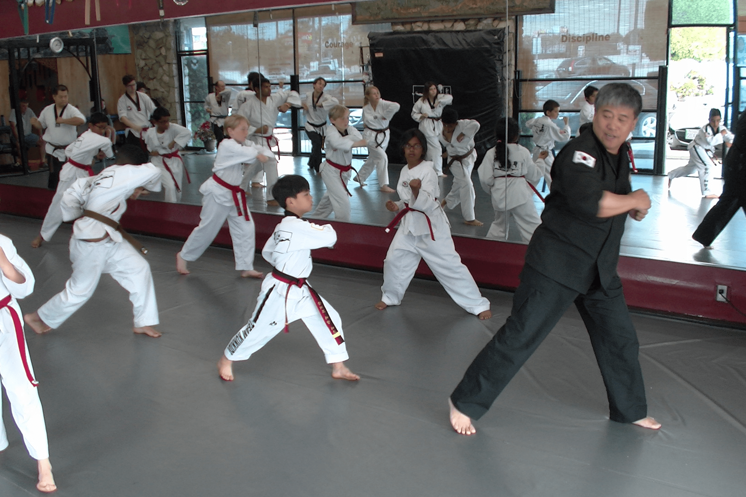 Martial arts class practicing moves